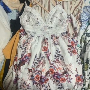 Very cute romper! Ties in the back.